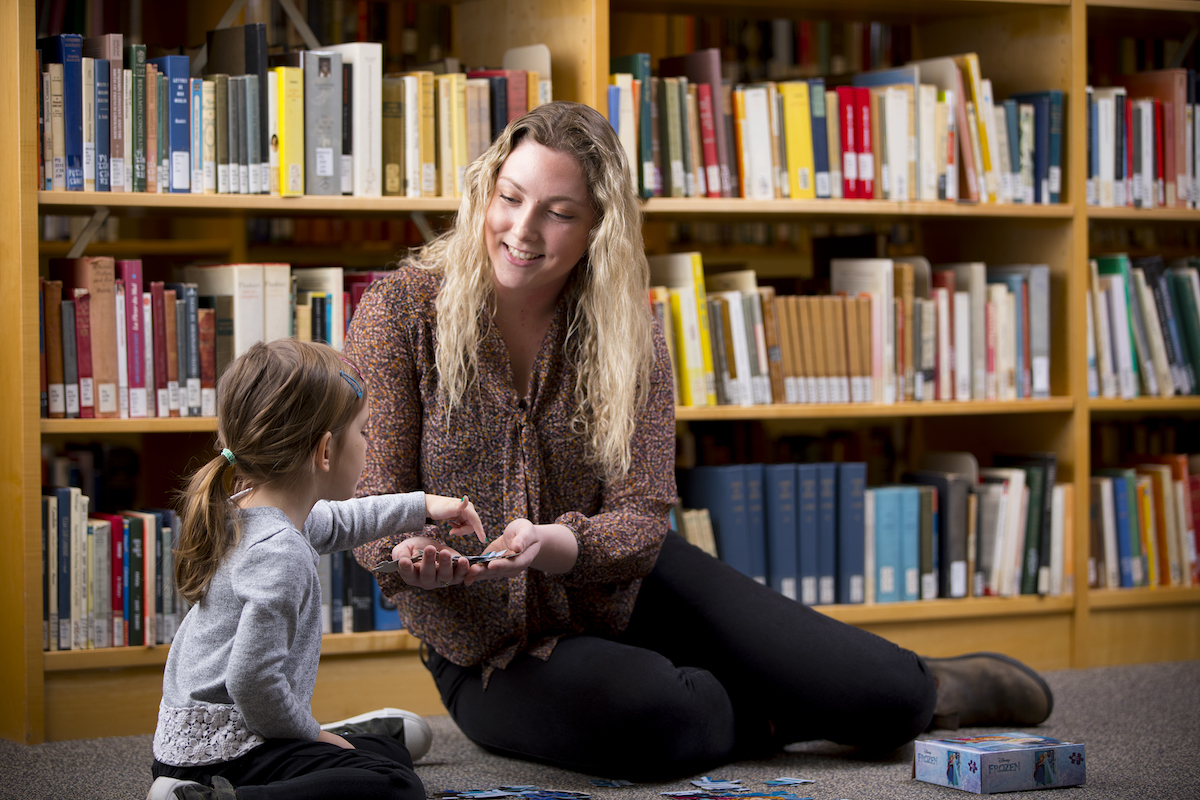 Family Studies student with child