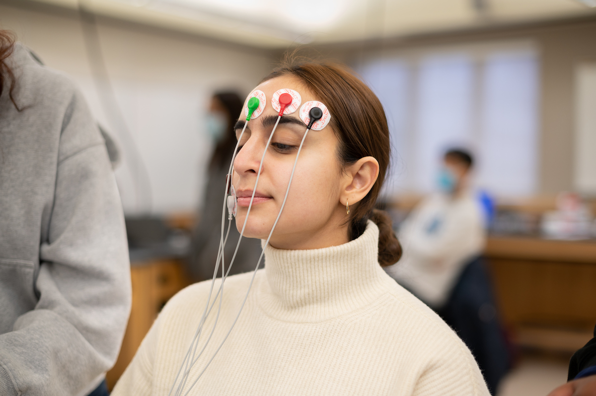 Medical Science student with electrodes attached to her head