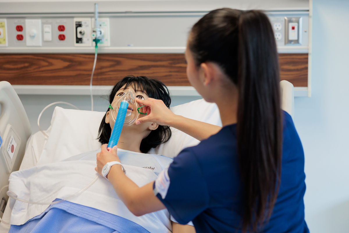 Nursing student in sumilation suite