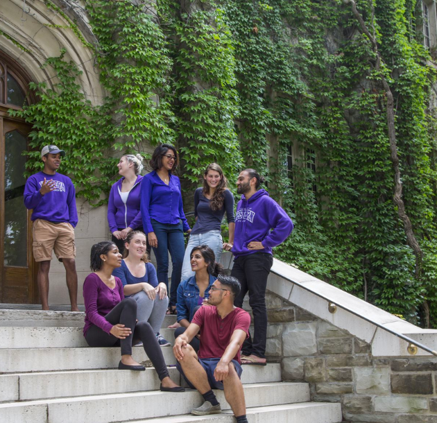 A group of Western students sitting on steps