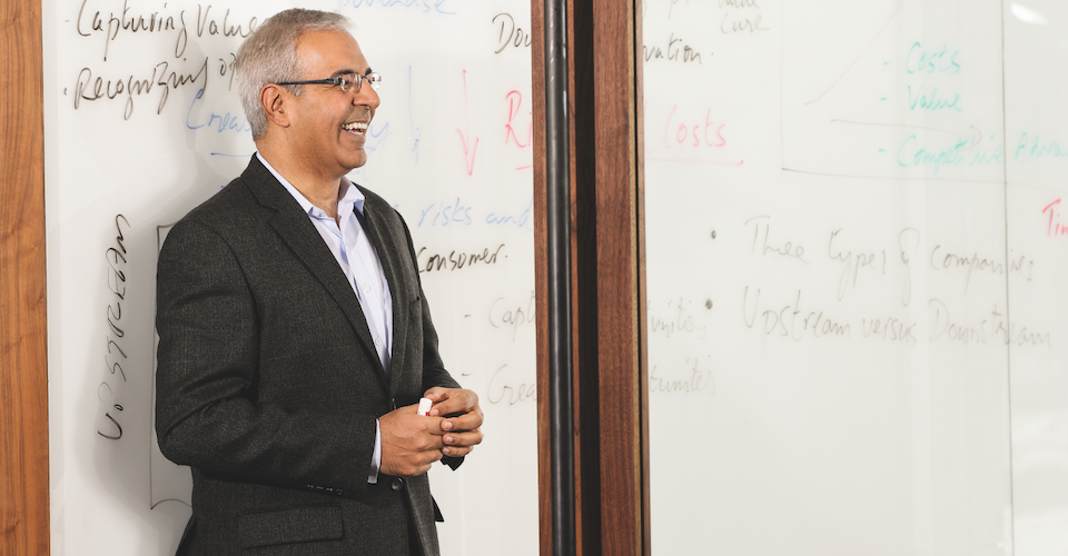 Ivey professor in front of a whiteboard