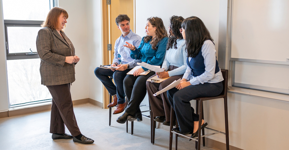 Professor Cheryl Currie speaks with master of public health students at Schulich School of Medicine and Dentistry. The new program expands training to the undergraduate level.