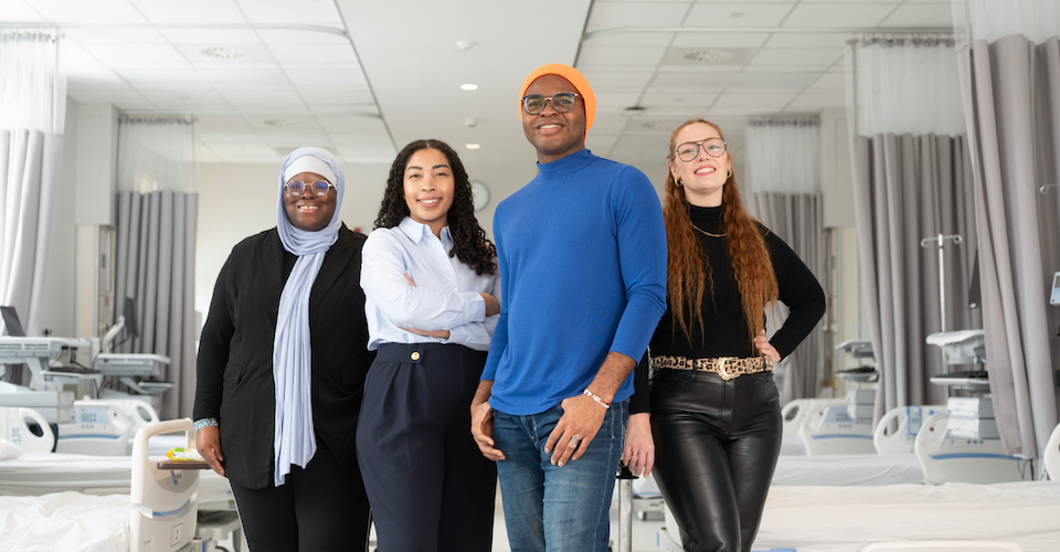 A team from Western's Arthur Labatt Family School of Nursing, all involved with a new Black student mentorship program, in the nursing simulation education suite. (L to R) Lecturer Safeyyah Raji, professor Danielle Fearon, student Charles Ozzoude and lecturer Ashley McKeown. (Iulia Costache/Faculty of Health Sciences)