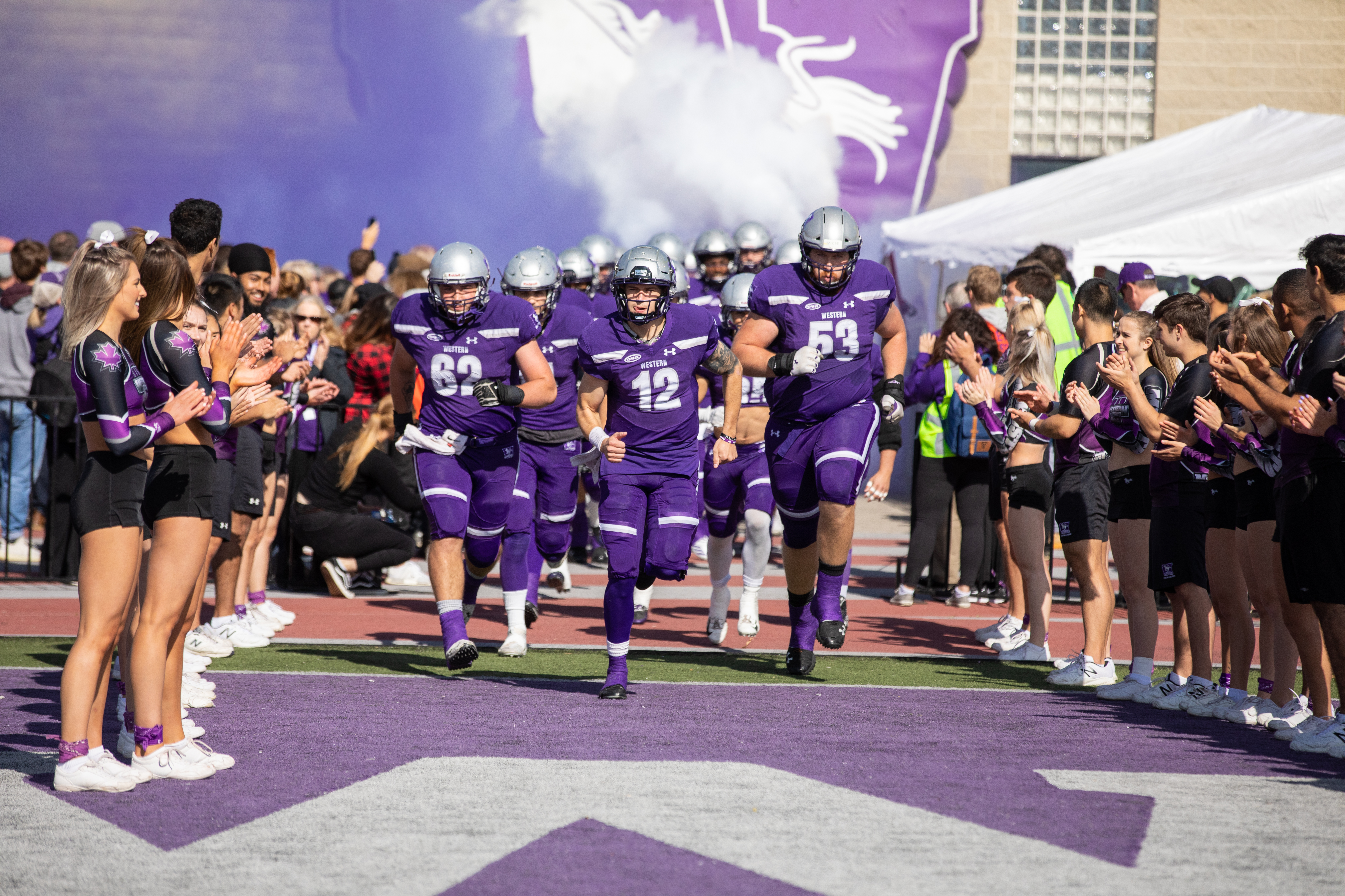 Students cheering at a football game