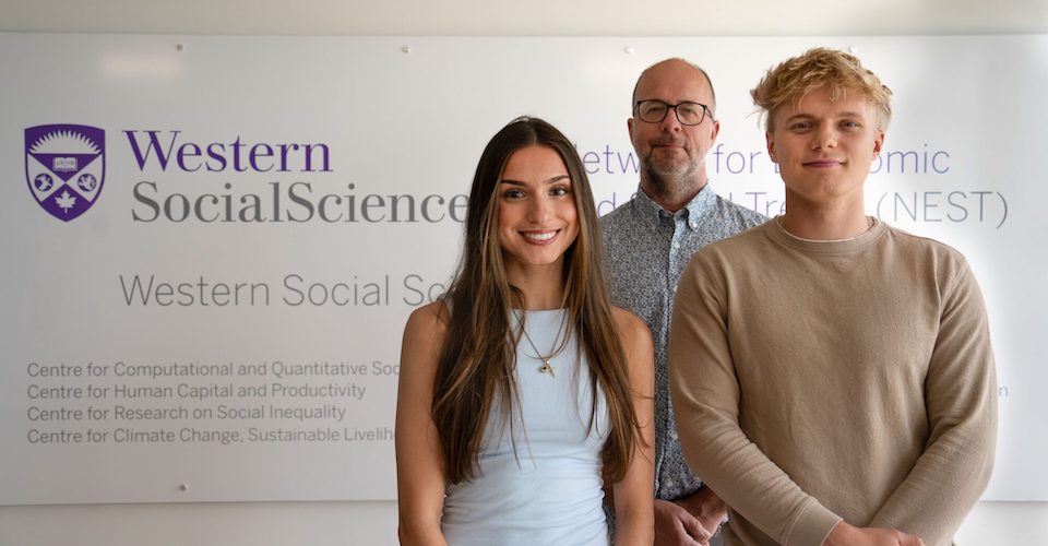 Sociology professor Michael Haan and Undergraduate Summer Research Internship students Aphrodite Podonis and Beniamin Kowal