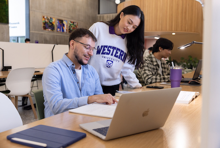 Two students laughing