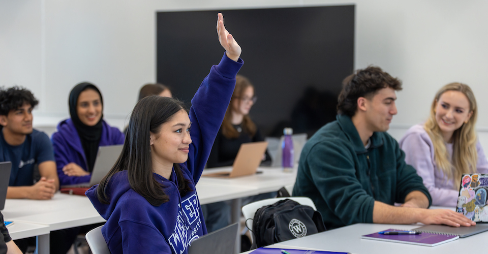 Student with hand raised