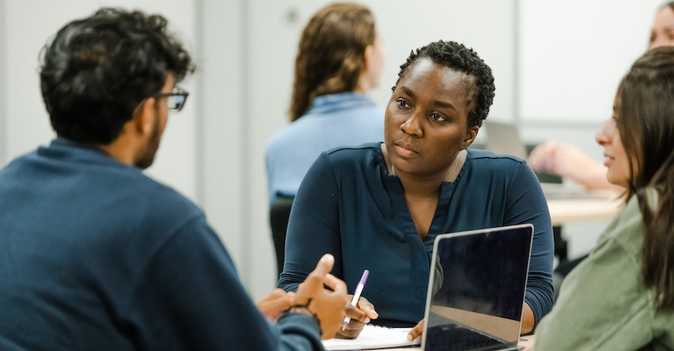 Staff member helping a student