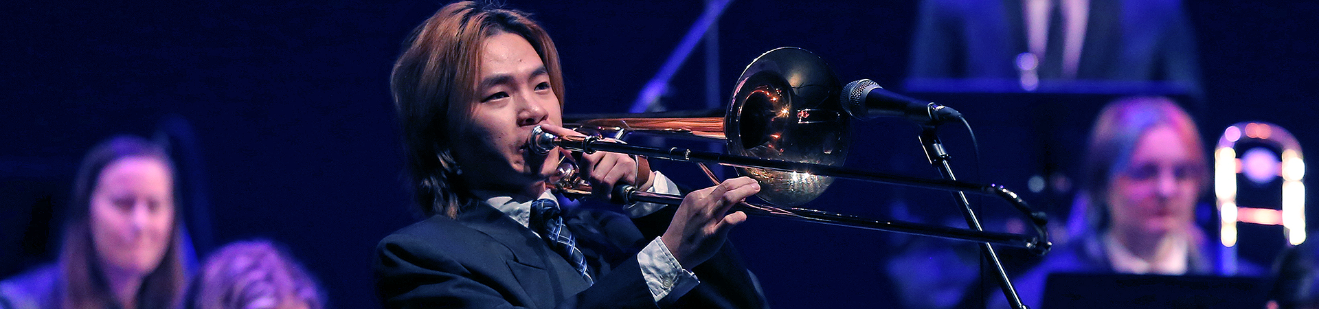 Student playing a brass instrument
