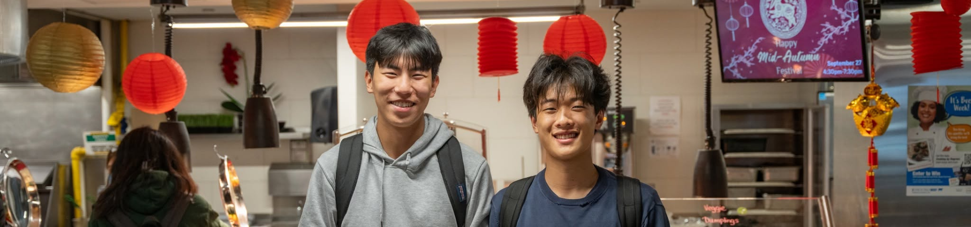 Students in residence dining hall celebrating the Lunar New Year through cultural foods.