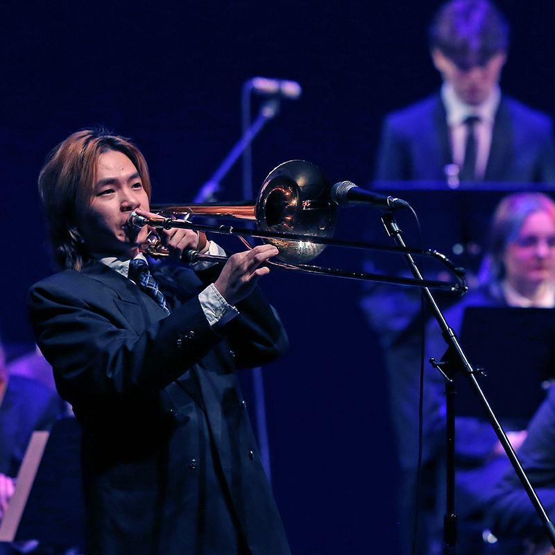 Student playing a brass instrument