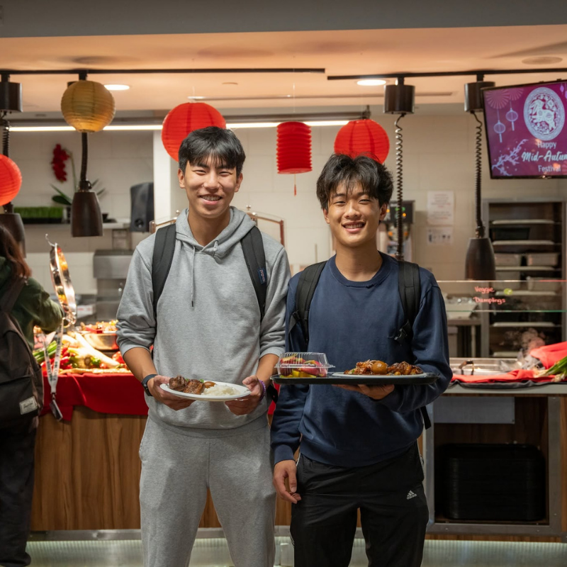 Students in residence dining hall celebrating the Lunar New Year through cultural foods.